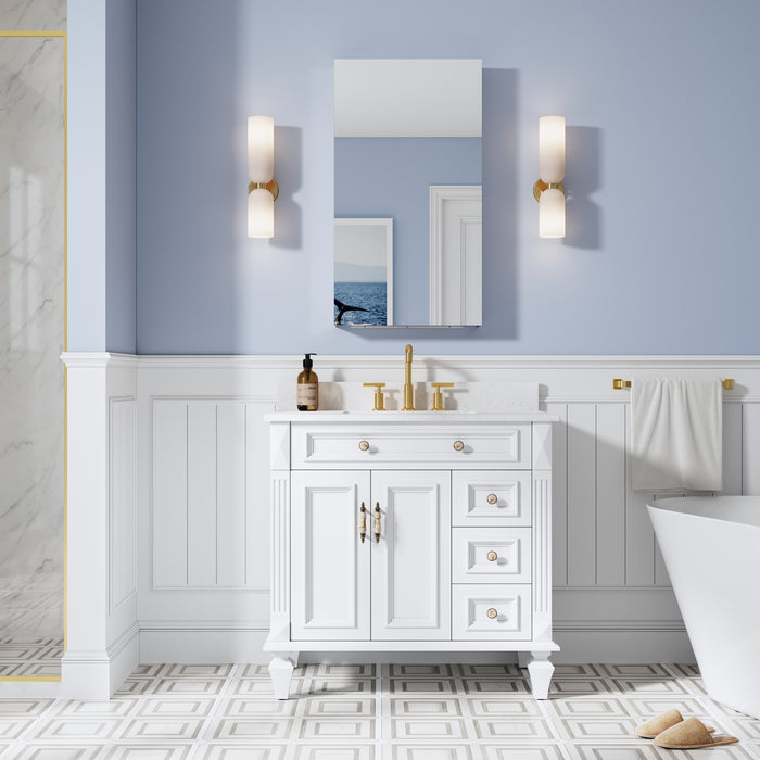 Bathroom with white vanity, mirror, and bathtub against a light blue wall.
