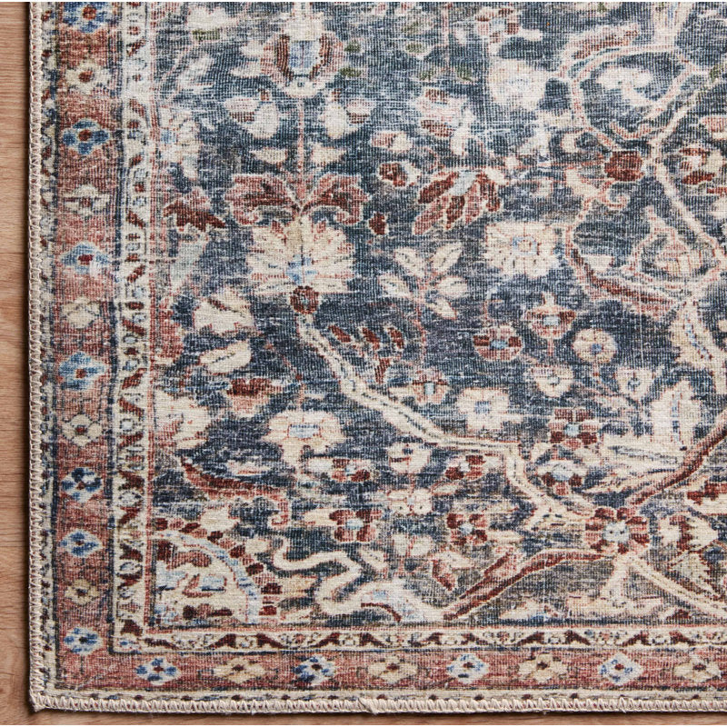 Decorative rug with floral pattern on a wooden floor