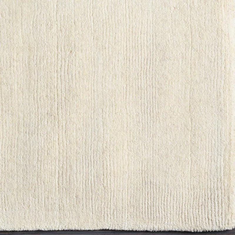 Close-up of a textured beige carpet
