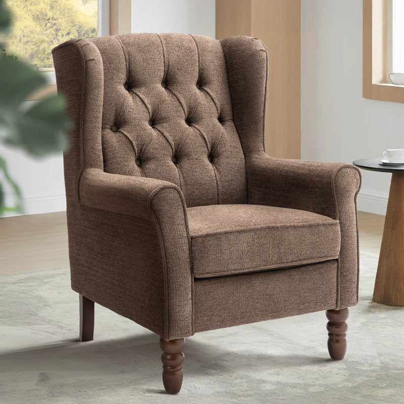 Brown upholstered armchair in a room with a table and window