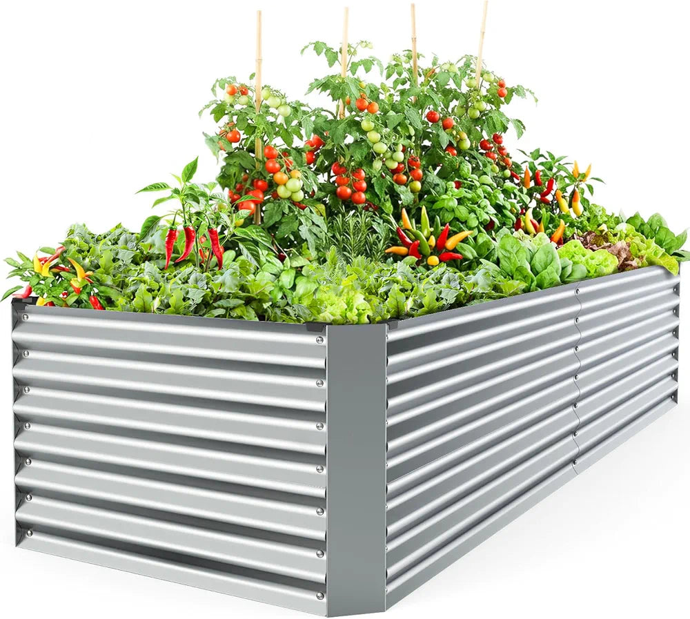 Metal raised garden bed with plants and vegetables on a white background
