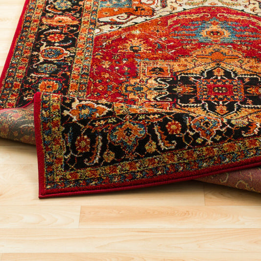 Decorative rug with intricate patterns on a wooden floor