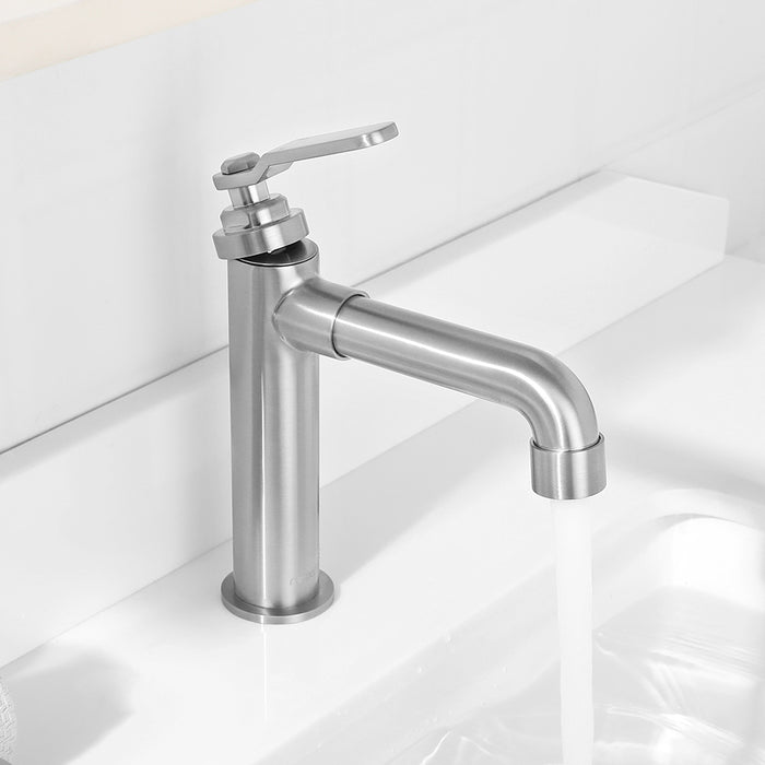 Stainless steel faucet on a white sink