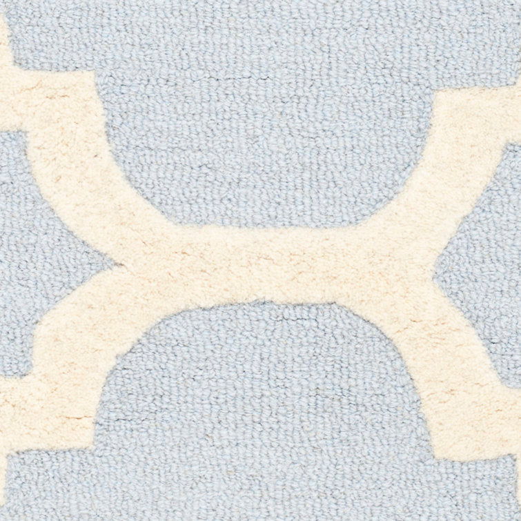 Tapis Cannen géométrique en laine tuftée à la main, bleu clair/ivoire, 90 x 150 cm